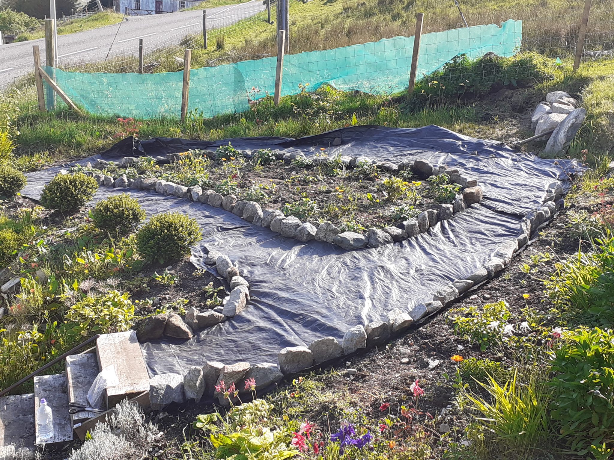 Laying weed control membrane when making a lasting garden path